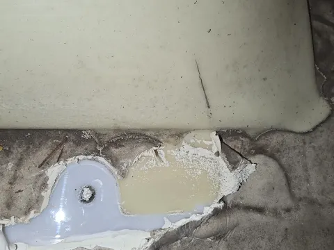 you can tell we had adhesion around the screws but there's some yellow showing directly underneath the lap ceiling showing not adhered another failure point d on the right side to allow further wood replacement